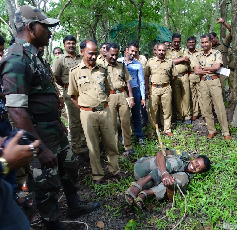 Indian law enforcement officials learn how to apprehend a suspect in the forest at a training on methods to combat wildlife crime in August. Seven or eight such trainings now take place across the country each year. Photo courtesy of TRAFFIC India.