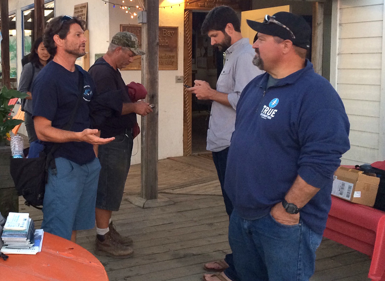 California Stranding Network Coordinator Justin Viezbicke (left) talks to crab fisherman Geoff Bettencourt (right) at a training teaching fishermen how to respond to entangled whales in Half Moon Bay, California, on October 20.