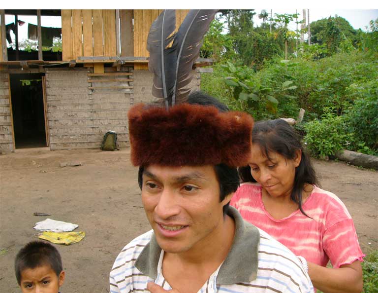Native community member with a yellow-tailed woolly monkey (Oreonax flavicauda) skin/pelt as headdress. Photo by Anne DeLuycker