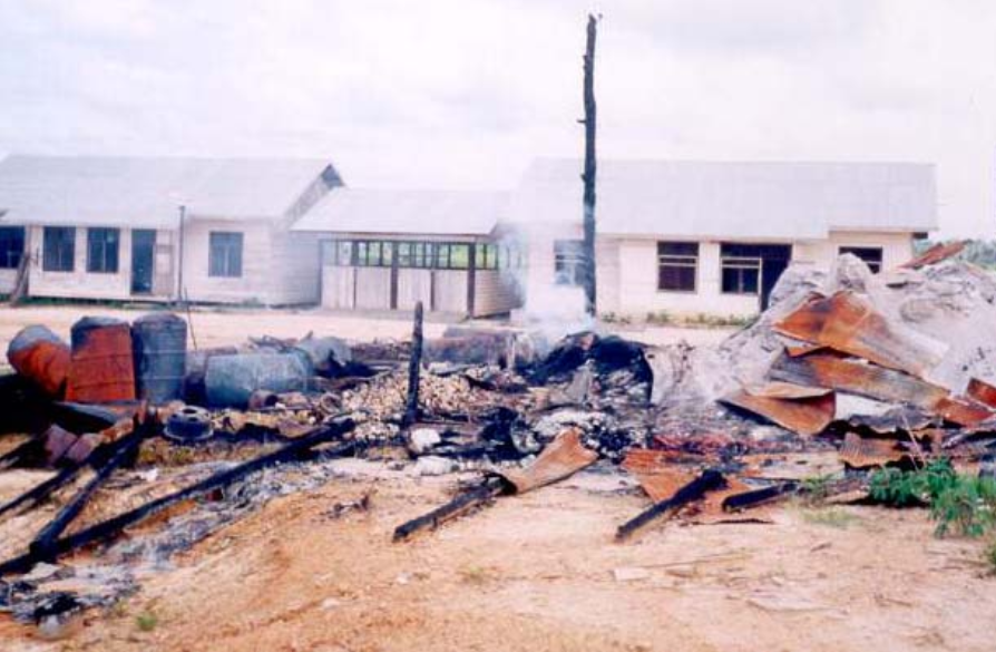 London Sumatra's burned out base camp in the 1990s. Photo courtesy of Telapak