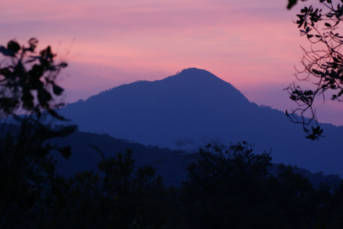 A mountain in silhouette inside Nigeria's Gashaka-Gumti National Park. Photo by Rosemary Lodge/Flickr. 