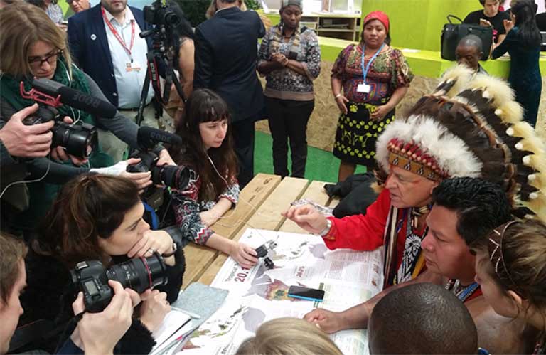 2)Indigenous leaders present research on land rights at a Green Zone press conference at Paris Climate Summit last December. Photo by Mitch Paquette