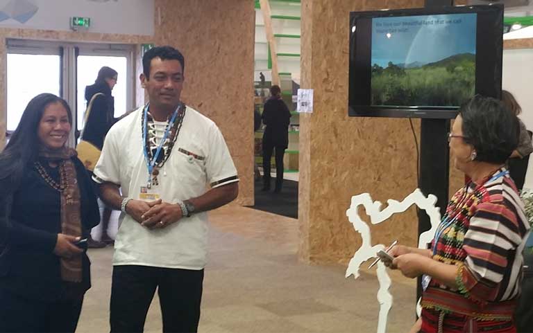 3)Nicholas Fredericks makes a presentation highlighting Wapichan community-led forest management at COP21. The Wapichan live in the Amazon rainforest of Guyana. Photo by Mitch Paquette.