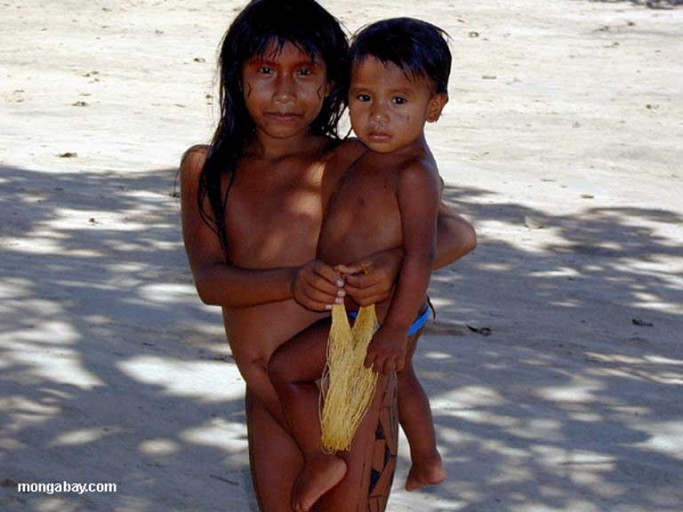 A Kaiapo mother and child. Riverine indigenous tribes in the Amazon and throughout South America’s interior face an uncertain future in the face of proposed infrastructure projects, especially dams, brought to rural areas by IIRSA and BNDES. Photo by Rhett A. Butler