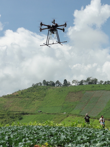 A drone that could be used to spray crops or forest plantations. The demonstration took place during a workshop on automated forest restoration this fall in Thailand. Photo by S. Elliott. 