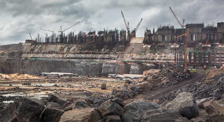 Construction site of the Belo Monte dam, on the Xingu river, Brazil. There have been important failings in the licensing process here, say government critics, including a deeply flawed Environmental Impact Assessment, and a lack of free, prior and informed consent for affected communities. Photo © Carol Quintanilha / Greenpeace