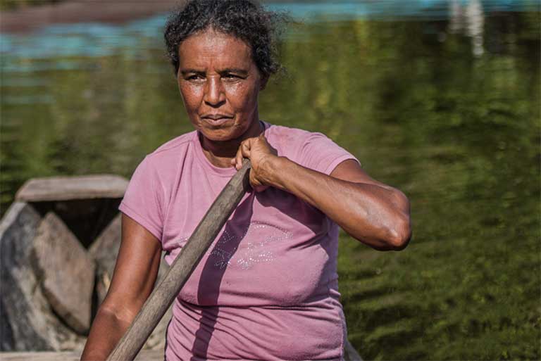 Dona Zefa in her canoe. Photo by Mauricio Torres