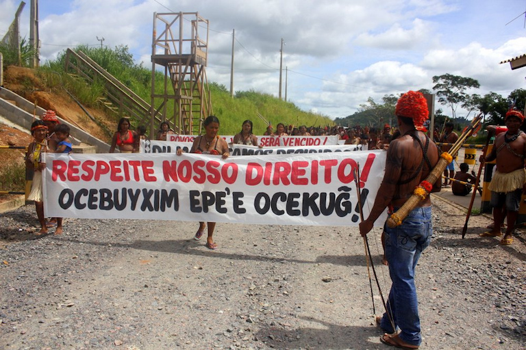 "Respect Our Rights," reads a banner at an indigenous protest against the fiercely contested Belo Monte hydro-electric dam under construction in northern Brazil. Photo by Ocupacao Munduruku.