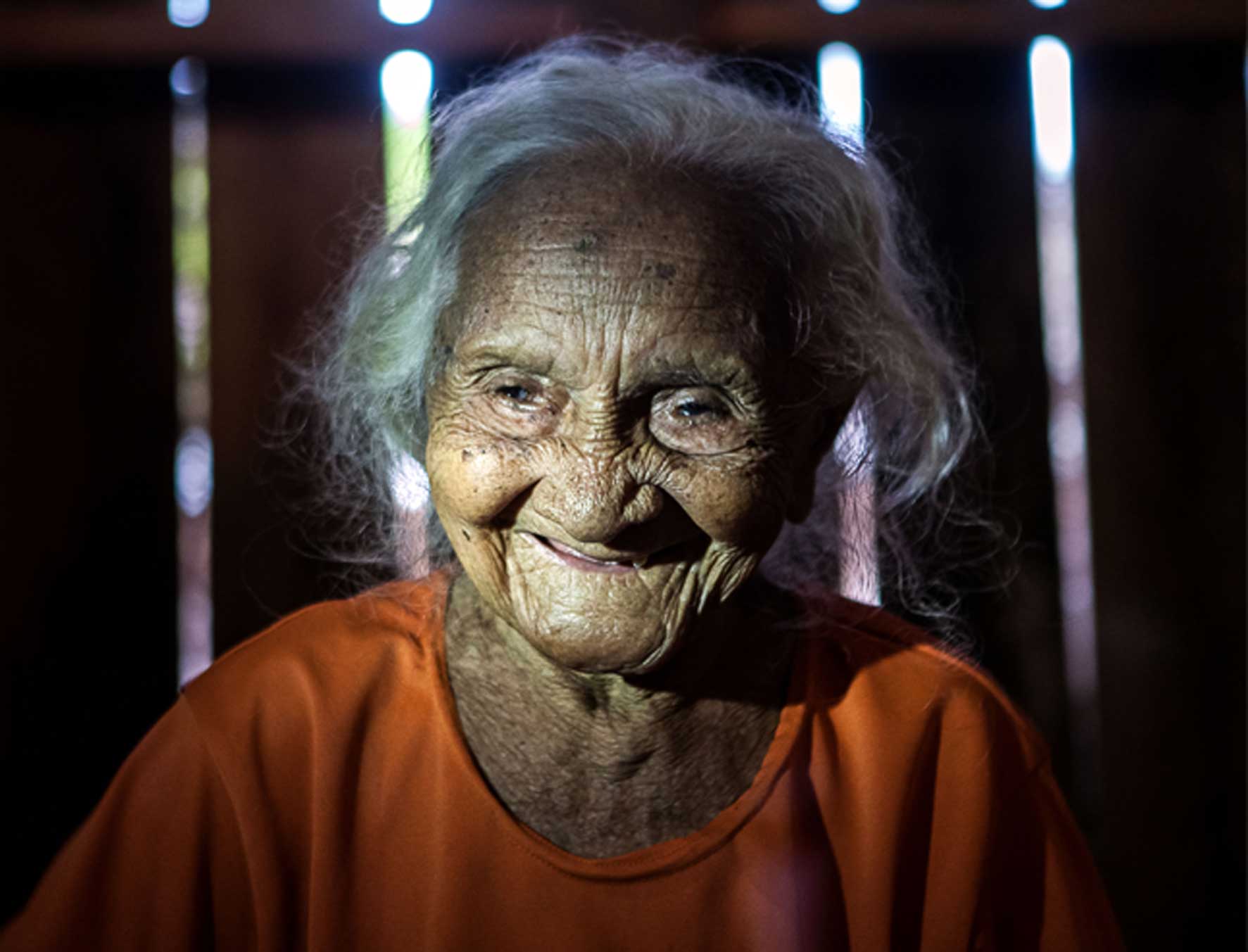 107-year-old Dona Bibiana is the oldest inhabitant of Pimental which will be flooded by the new dam. She gets too upset and can’t discuss the flooding and destruction of her community, so prefers hunting stories from the past or tales of pink dolphins that became people. Photo by Lilo Clareto/Repórter Brasil