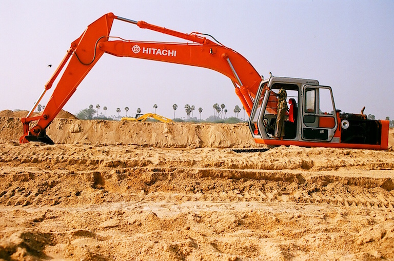 An earth mover prepares to load sand in Kanchipuram, Tamil Nadu. Photo by Sibi Arasu.