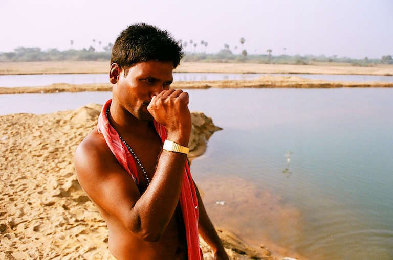 A truck driver waits at the Palar River in Kanchipuram, Tamil Nadu. Photo by Sibi Arasu.
