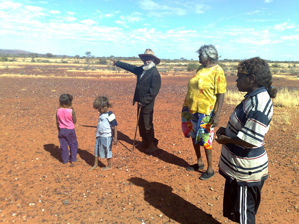 An elder tells a dreaming story in Angas Downs Indigenous Protected Area in Australia’s Northern Territory. Photo courtesy of Wikimedia Commons. 