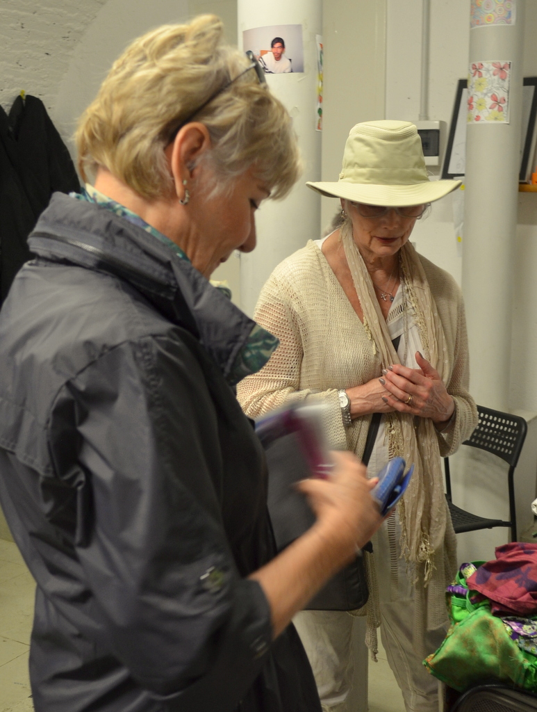 Long time friends Gail Griffith and Emmylou Harris checking out jewelry made by refugees. Photo by Justin Catanoso