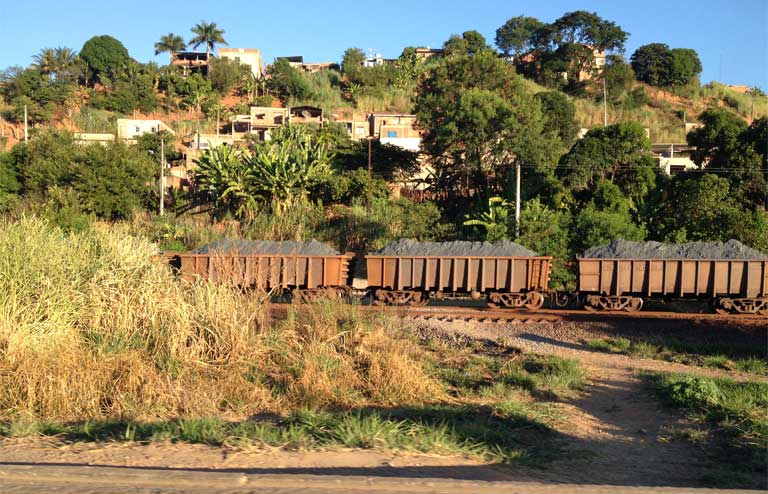 A freight train carries ore down the Rio Doce valley toward the port in Vitoría. Photo by Zoe Sullivan