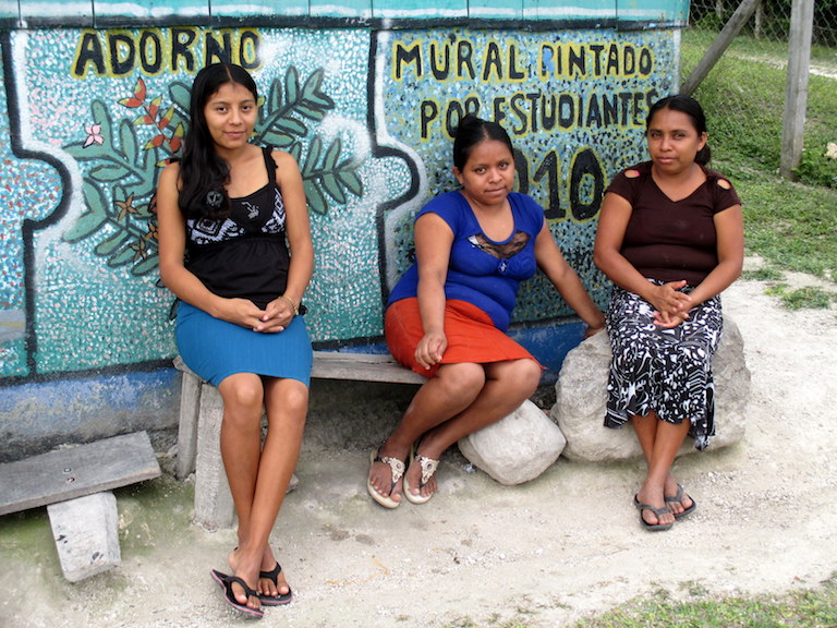 Uaxactún village residents chat outside the xate warehouse in their community forest concession, located in the multi-use zone of the Maya Biosphere Reserve. Photo by Sandra Cuffe.