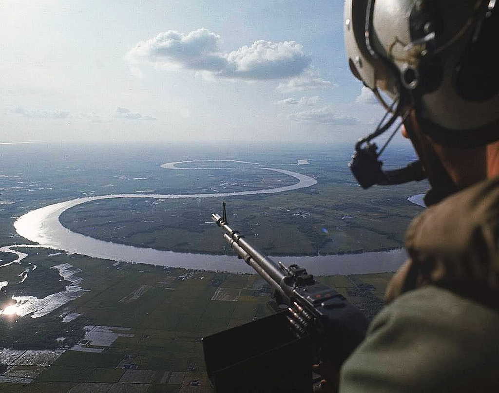 A heli door gunner over the Mekong Delta in 1967. Photo by manhhai/Flickr