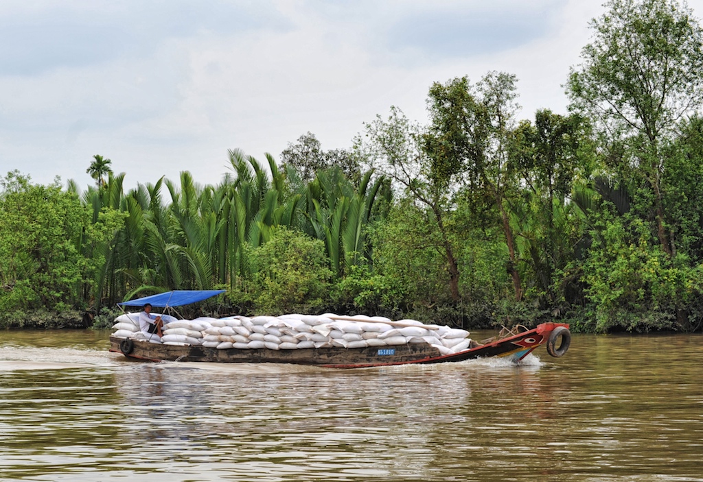 A boatload of rice in the Mekong Delta. Photo by Richard Vignola/Flickr