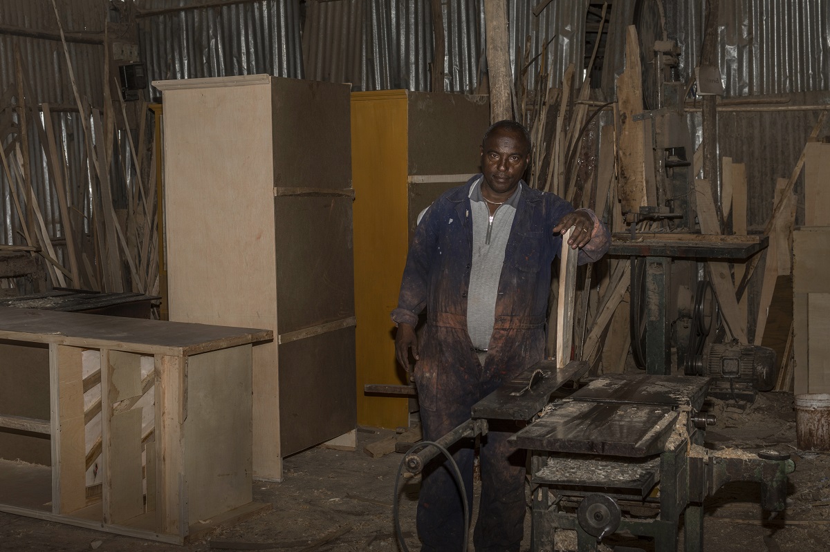 Tadese Sheferaw came up in the world through hard work as a carpenter, and two of his eight children have followed in his footsteps. Photo by Maheder Haileselassie Tadese for Mongabay
