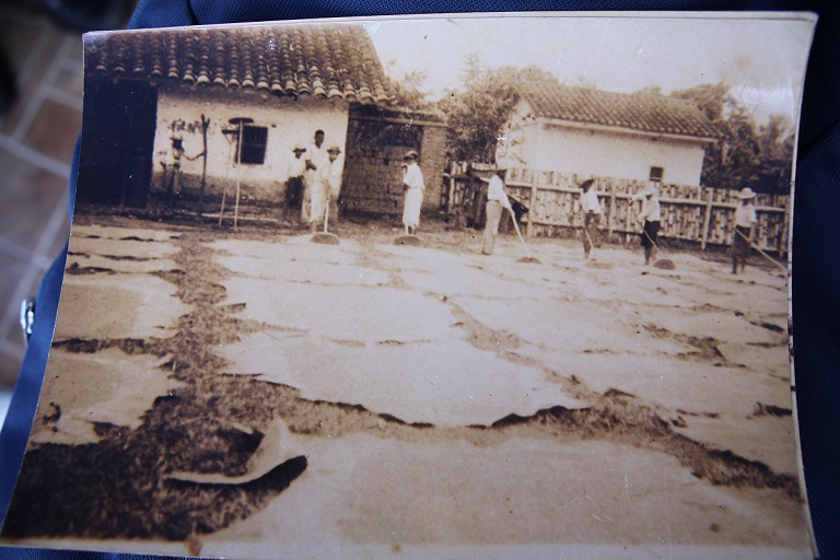 Historical photograph of Puerto Tejada from the early 1900's, showing the local Afro-Colombian population spreading cacao that they had harvested from their own fields. Photo provided by local resident Weimar Possu Diaz