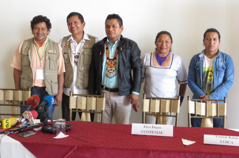 Participants at a press conference in Quito last Thursday included Shuar community members Tuntiak Katan, far right, and Elvia Dagua, second from right. Photo by Kimberley Brown for Mongabay