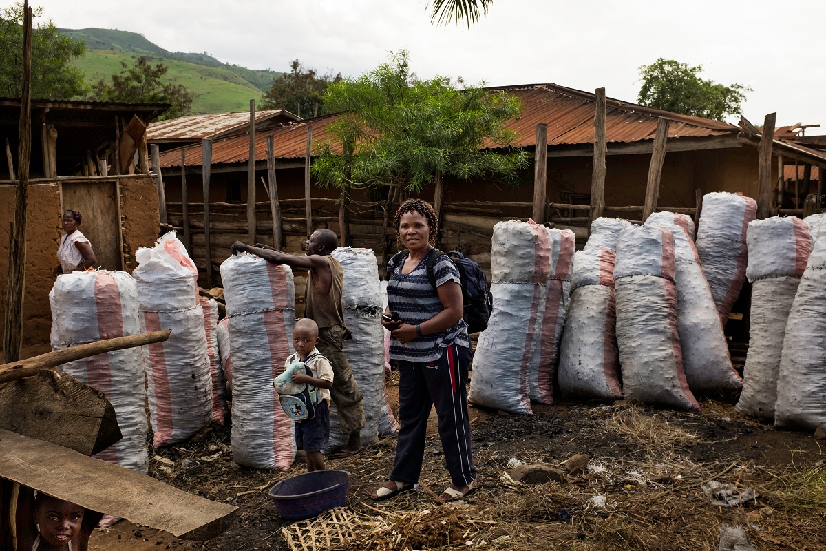 Charcoal wholesaler Marie-Médiatrice Shamba at her charcoal deposit in Goma, Nyamilima, North Kivu, DRC, November 2016. Photo by Leonora Baumann for Mongabay.